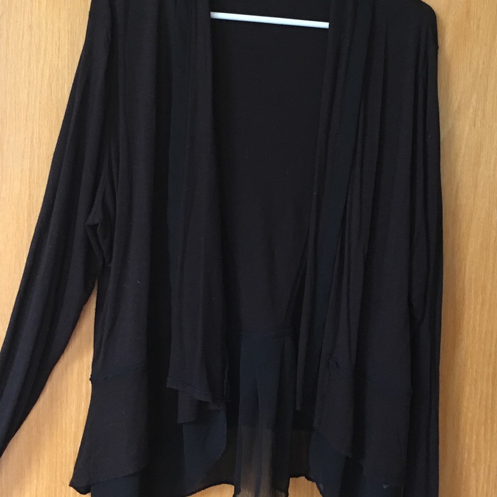 Maurice’s black cardigan.